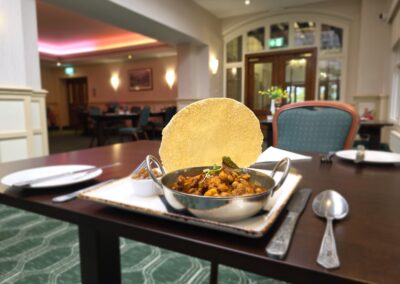 Curry with popadom in the restaurant at The Birch Hotel