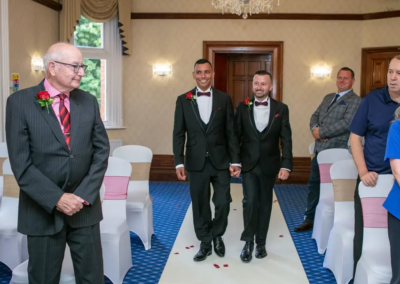 Couple walking down the aisle to get married at The Birch Hotel