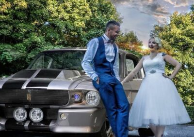 'Rocker' Wedding couple stood infront of car