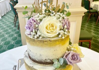 Cream Wedding Cake with white and lilac roses