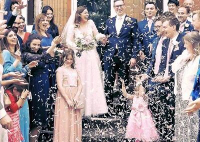 Married Couple under thrown confetti